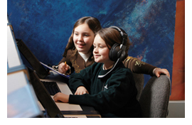 Image of two students working through a live Challenger Learning Center simulation.