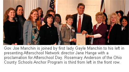 West Virginia Gov. Joe Manchin is joined by first lady Gayle Manchin to his left in presenting Afterschool Network director Jane Hange with a proclamation for Afterschool Day at the West Virginia Legislature. Rosemary Anderson, director of the Ohio County Schools Anchor Program, is third from left in the front row.